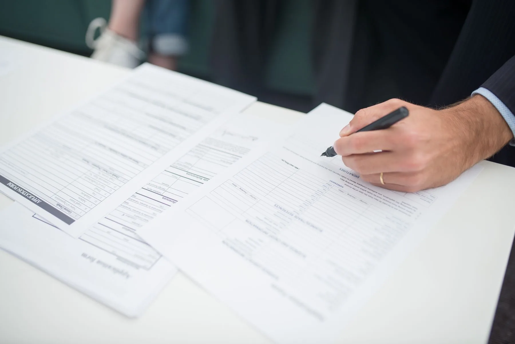 Insurance paperwork being reviewed at a desk.